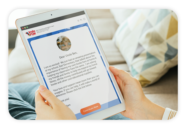 a close up of hands holding a tablet device showing a mockup of an email invitation